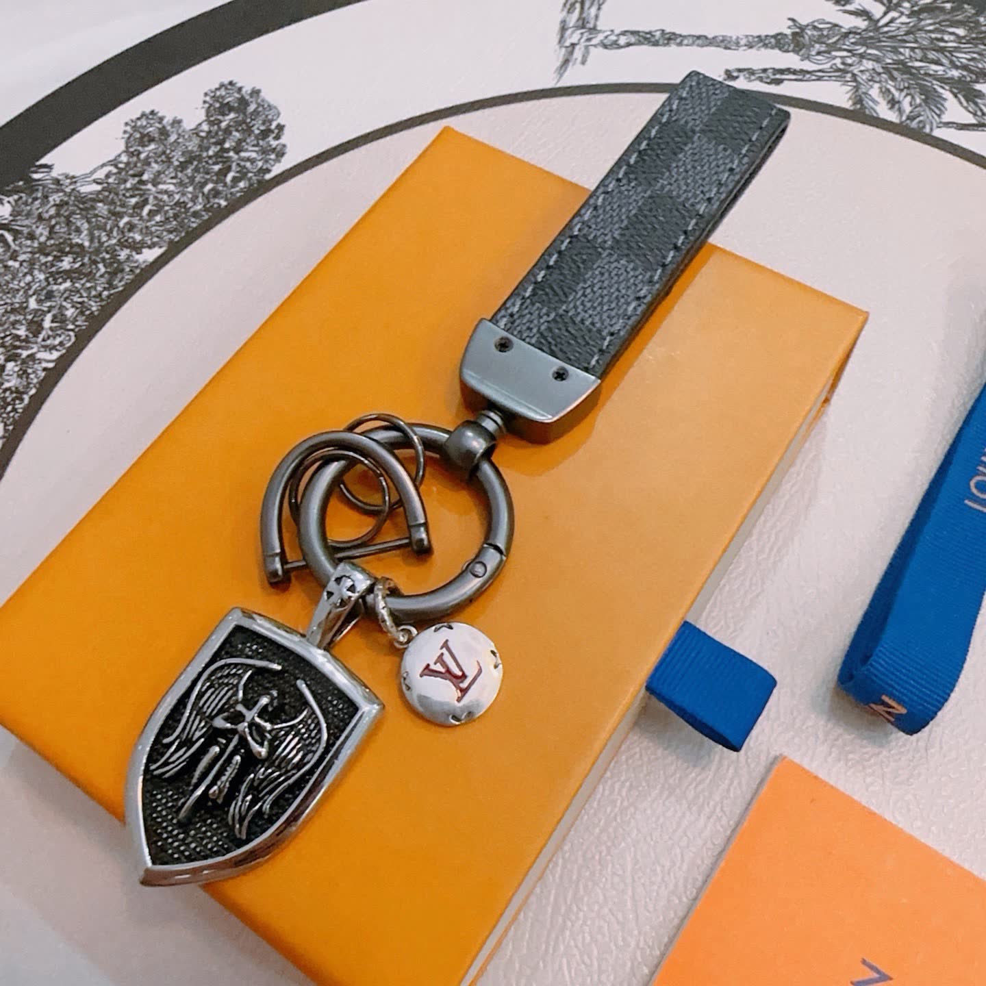 Louis Vuitton Keychain with Shield and Leather Strap